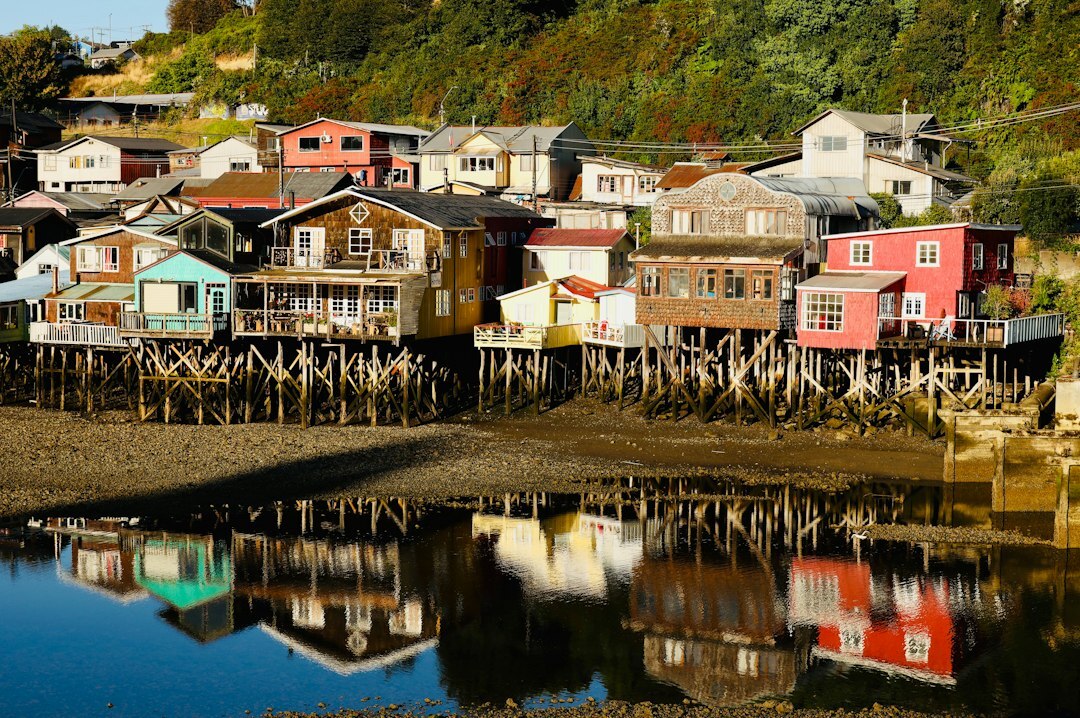 Wooden palafito houses on stilts over the water in Chiloé